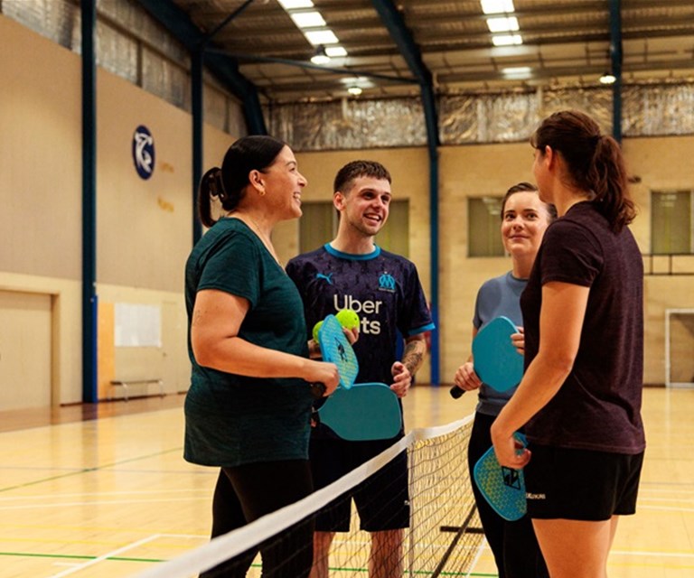 Group of people playing pickleball